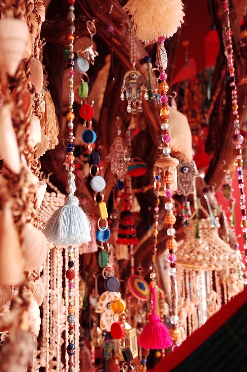 a bunch of beads hanging from a ceiling